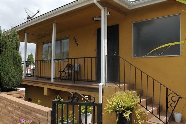 doorway to property with stucco siding