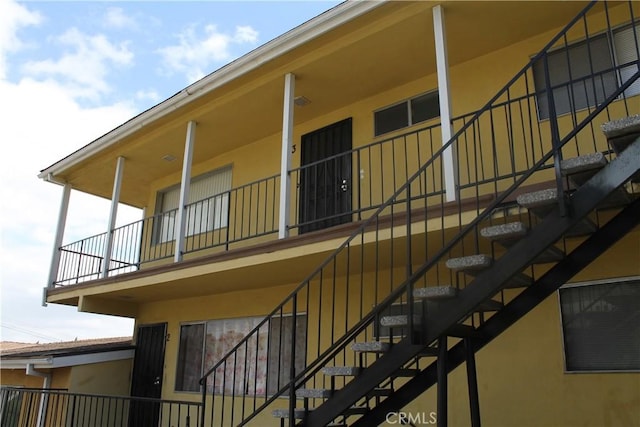view of property featuring stairs