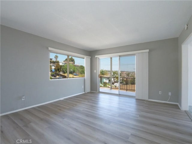 2302 S Gaffey St Unit 1, San Pedro, CA 90731 - spare room featuring baseboards and wood finished floors
