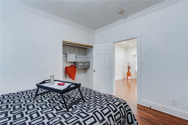 1449 W 45th St, Los Angeles, CA 90062 - bedroom with wood finished floors, crown molding, baseboards, and a closet