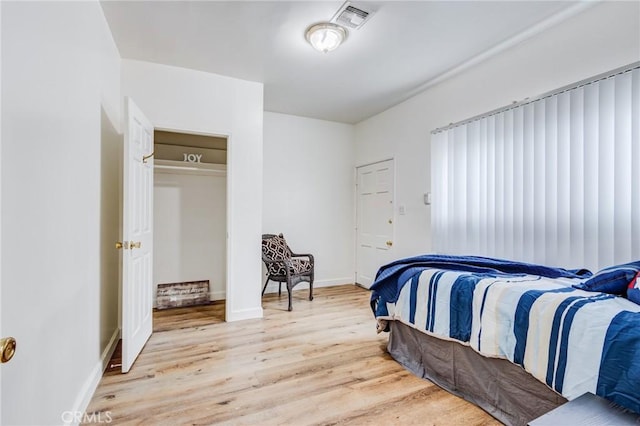 1449 W 45th St, Los Angeles, CA 90062 - bedroom featuring light wood-style floors and baseboards