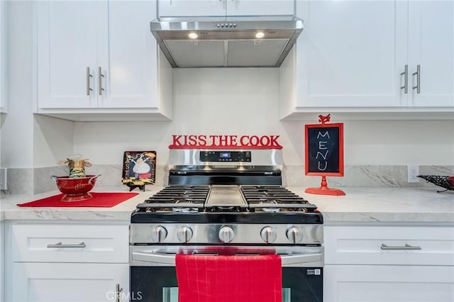 1449 W 45th St, Los Angeles, CA 90062 - kitchen with stainless steel gas range, ventilation hood, and white cabinetry