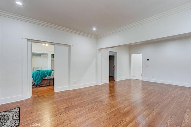 1449 W 45th St, Los Angeles, CA 90062 - spare room featuring ornamental molding, light wood-type flooring, baseboards, and recessed lighting