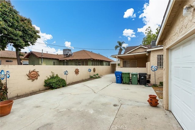 1449 W 45th St, Los Angeles, CA 90062 - view of patio with a garage