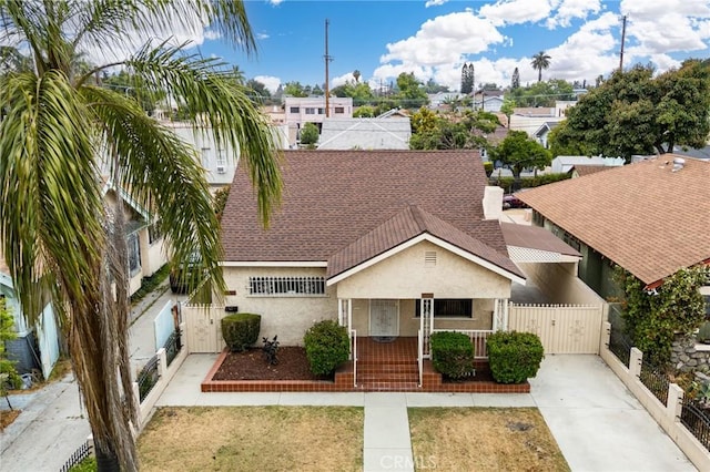1449 W 45th St, Los Angeles, CA 90062 - view of front of home featuring a gate, stucco siding, covered porch, and a residential view