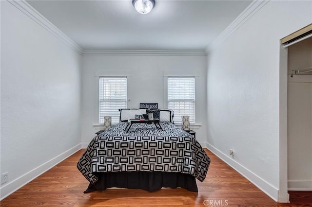 1449 W 45th St, Los Angeles, CA 90062 - bedroom with crown molding, baseboards, and wood finished floors