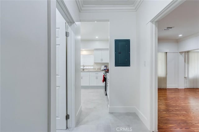 1449 W 45th St, Los Angeles, CA 90062 - hall with electric panel, crown molding, a sink, and baseboards