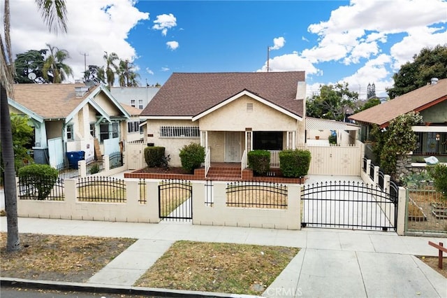 1449 W 45th St, Los Angeles, CA 90062 - bungalow-style house featuring a gate, a fenced front yard, and stucco siding