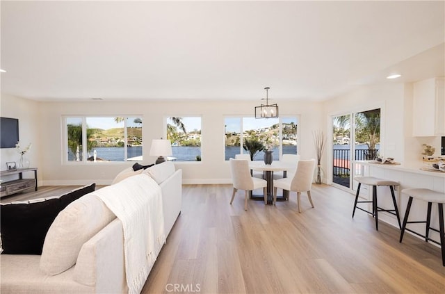 29284 Big Range Rd, Canyon Lake, CA 92587 - living area with healthy amount of natural light, a chandelier, light wood finished floors, baseboards, and recessed lighting