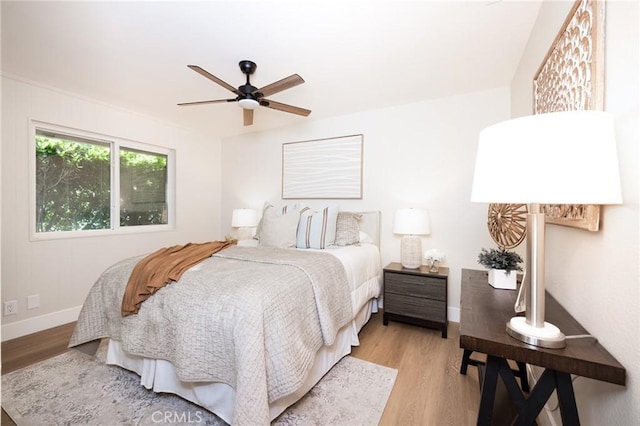 29284 Big Range Rd, Canyon Lake, CA 92587 - bedroom with light wood-style floors, baseboards, and a ceiling fan