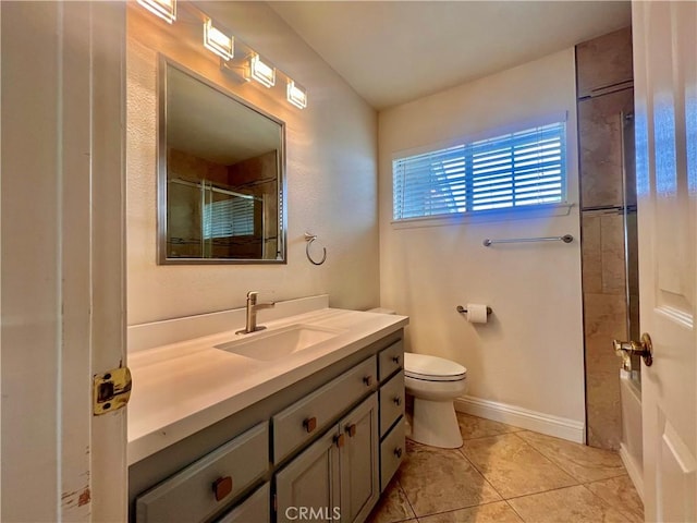 18725 Dallas Ave, Riverside, CA 92508 - bathroom featuring toilet, a shower with shower door, tile patterned floors, baseboards, and vanity
