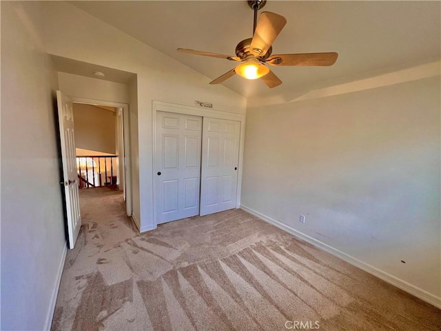 18725 Dallas Ave, Riverside, CA 92508 - unfurnished bedroom featuring baseboards, light carpet, a closet, and vaulted ceiling