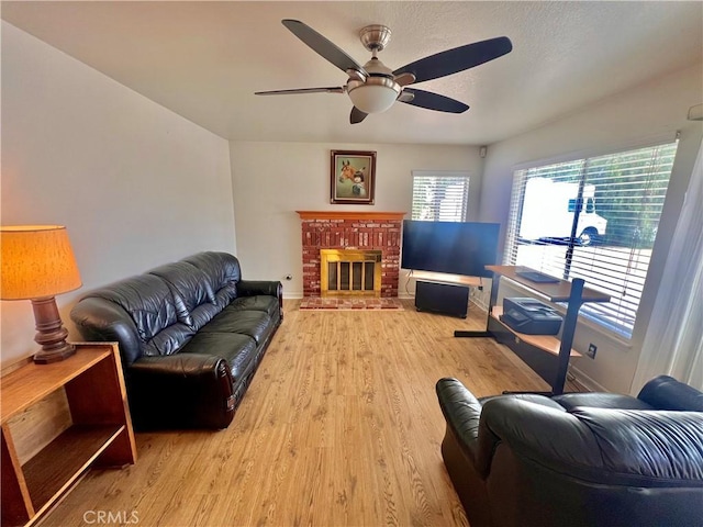 18725 Dallas Ave, Riverside, CA 92508 - living room featuring wood finished floors, baseboards, ceiling fan, and a fireplace