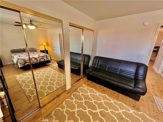 18725 Dallas Ave, Riverside, CA 92508 - bedroom with two closets, wood finished floors, and a ceiling fan