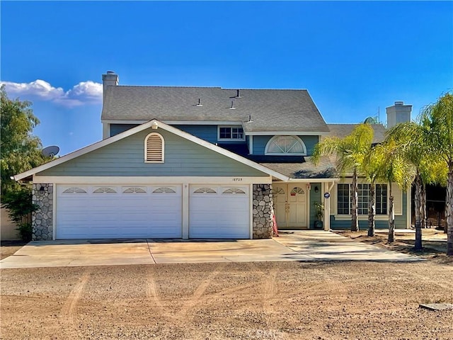 18725 Dallas Ave, Riverside, CA 92508 - traditional-style house featuring concrete driveway, a chimney, a garage, and stone siding