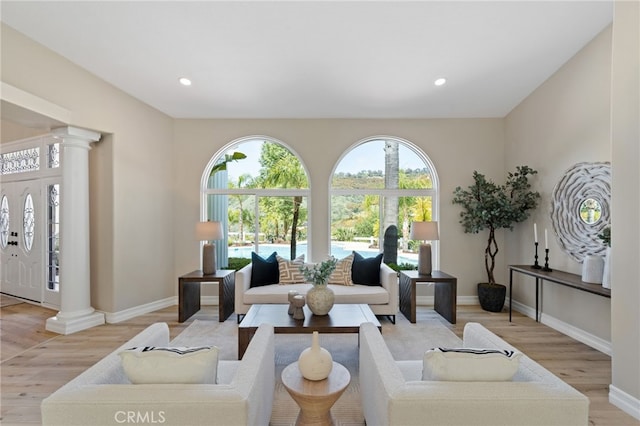 44240 La Cruz Dr, Temecula, CA 92590 - living area with light wood-style floors, baseboards, ornate columns, and recessed lighting