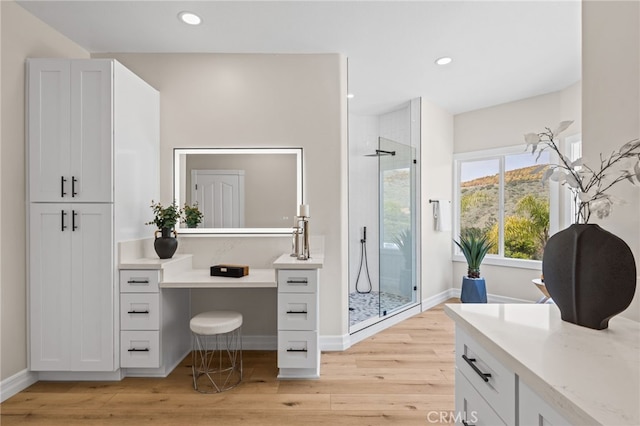 44240 La Cruz Dr, Temecula, CA 92590 - bathroom featuring wood finished floors, a stall shower, baseboards, vanity, and recessed lighting