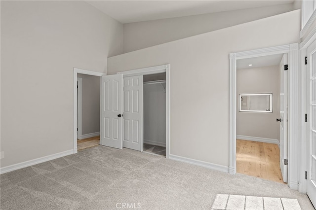 44240 La Cruz Dr, Temecula, CA 92590 - unfurnished bedroom featuring baseboards, carpet flooring, a closet, and high vaulted ceiling