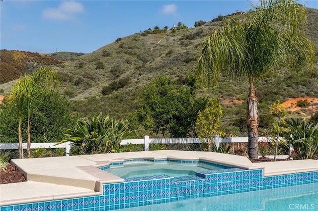 44240 La Cruz Dr, Temecula, CA 92590 - view of pool featuring an in ground hot tub, a mountain view, and fence