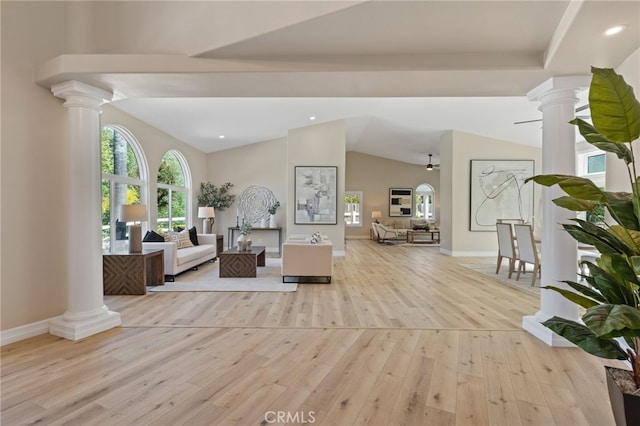 44240 La Cruz Dr, Temecula, CA 92590 - living area with light wood-type flooring, baseboards, lofted ceiling, and ornate columns