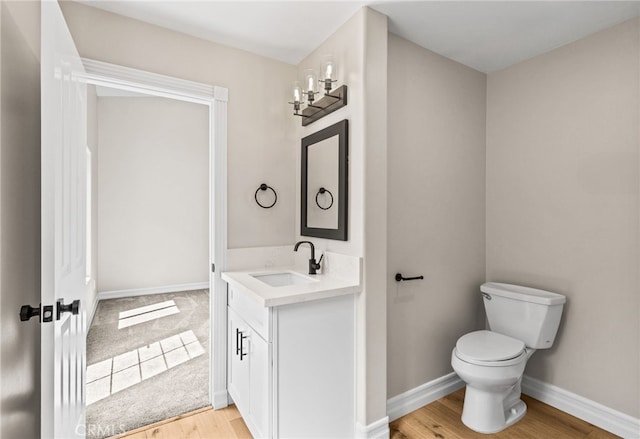 44240 La Cruz Dr, Temecula, CA 92590 - bathroom with vanity, toilet, baseboards, and wood finished floors