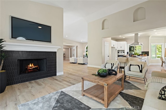 44240 La Cruz Dr, Temecula, CA 92590 - living room featuring light wood-style floors, a fireplace, baseboards, and recessed lighting