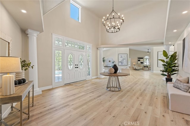 44240 La Cruz Dr, Temecula, CA 92590 - foyer featuring light wood-style floors, decorative columns, and a towering ceiling