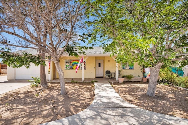 9546 Verdugo Ave, Hesperia, CA 92345 - ranch-style house with stucco siding, driveway, and a garage