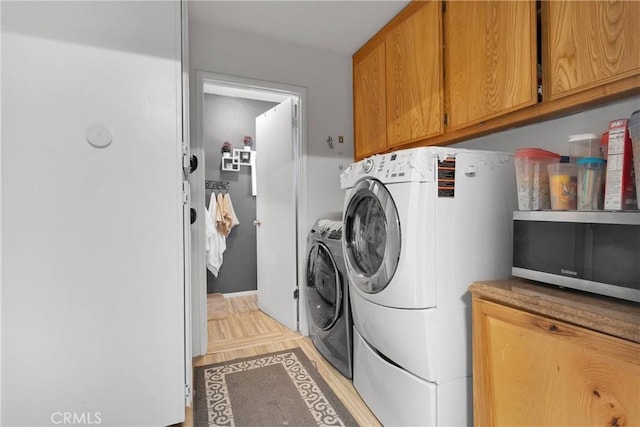 9546 Verdugo Ave, Hesperia, CA 92345 - laundry room featuring independent washer and dryer and cabinet space
