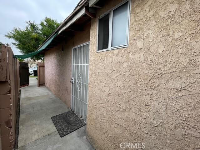 view of side of property with stucco siding