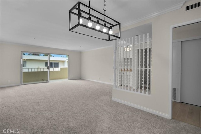 unfurnished living room with carpet, visible vents, baseboards, and ornamental molding
