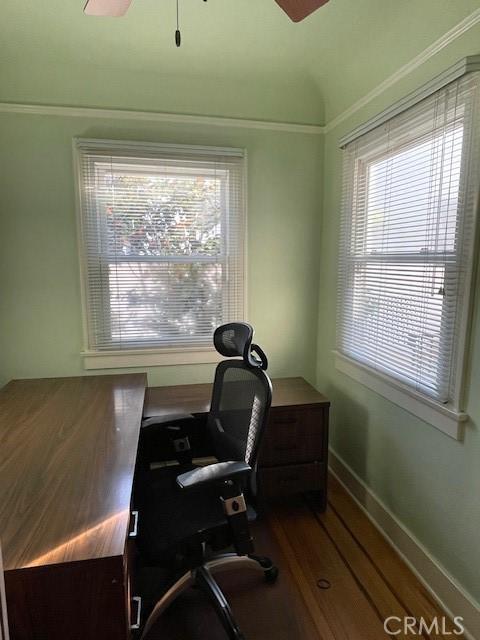 office space featuring a wealth of natural light, ornamental molding, and ceiling fan