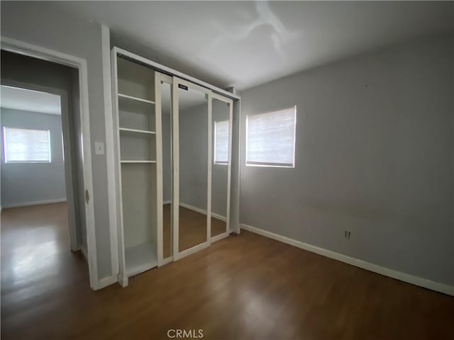 3428 W 189th St, Torrance, CA 90504 - unfurnished bedroom featuring wood finished floors, baseboards, and a closet