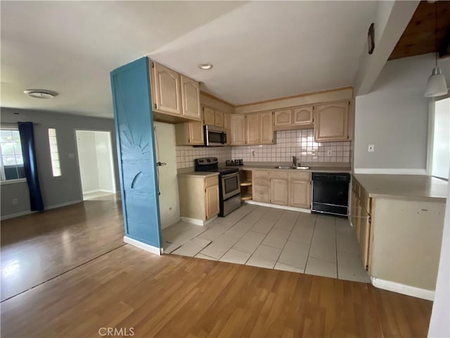 3428 W 189th St, Torrance, CA 90504 - kitchen featuring stainless steel appliances, a sink, decorative backsplash, light countertops, and light wood finished floors