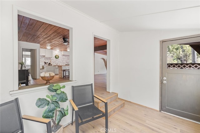 entryway featuring a wealth of natural light, a ceiling fan, and wood finished floors