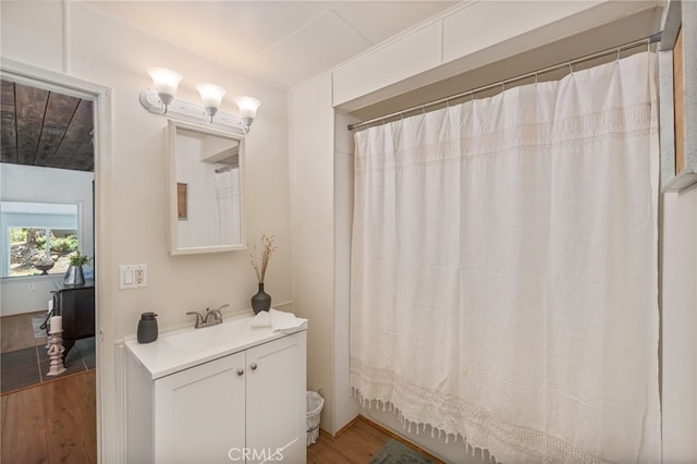 bathroom with vanity and wood finished floors