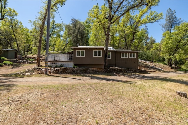 view of front of house with a front yard and crawl space