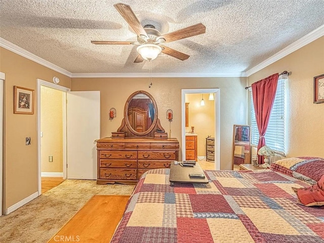 bedroom with carpet flooring, connected bathroom, crown molding, a textured ceiling, and ceiling fan