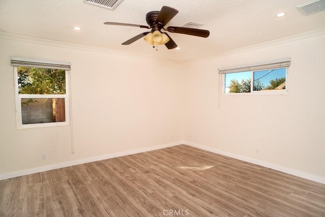 44315 88th St E, Lancaster, CA 93535 - spare room with wood finished floors, plenty of natural light, ornamental molding, recessed lighting, and baseboards