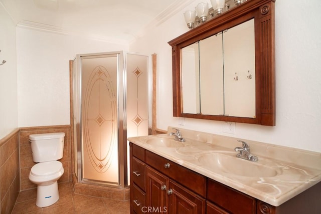 44315 88th St E, Lancaster, CA 93535 - bathroom with toilet, double vanity, tile patterned flooring, ornamental molding, and wainscoting