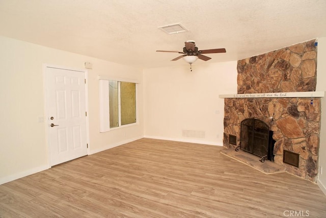 44315 88th St E, Lancaster, CA 93535 - unfurnished living room with a ceiling fan, light wood-type flooring, a fireplace, and baseboards
