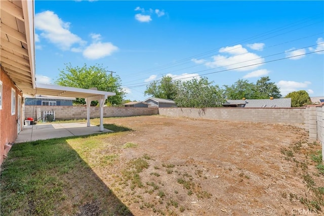 view of yard featuring a fenced backyard and a patio