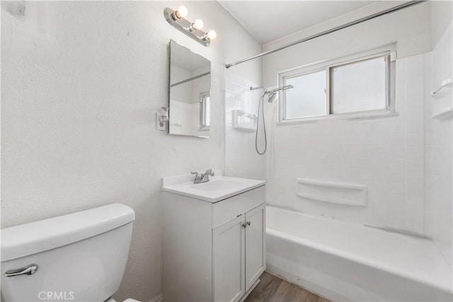 full bathroom with toilet, vanity, bathtub / shower combination, and wood finished floors