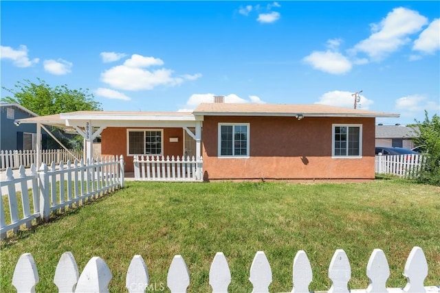ranch-style home with stucco siding, a fenced front yard, and a front lawn