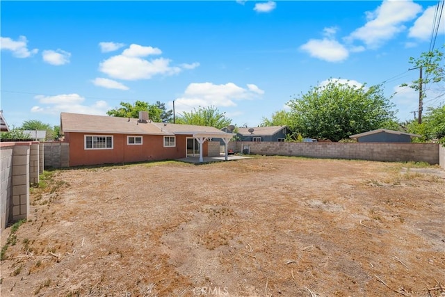 view of yard featuring a patio and a fenced backyard