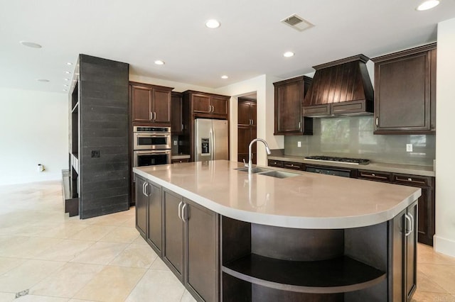 kitchen featuring a sink, open shelves, backsplash, appliances with stainless steel finishes, and premium range hood