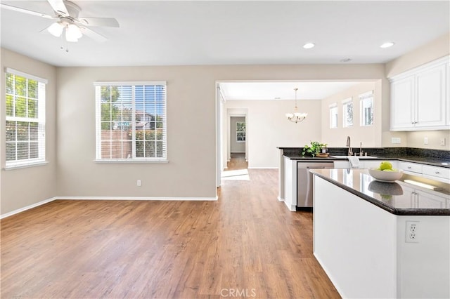 39992 Pasadena Dr, Temecula, CA 92591 - kitchen with stainless steel dishwasher, a chandelier, a peninsula, healthy amount of natural light, and recessed lighting
