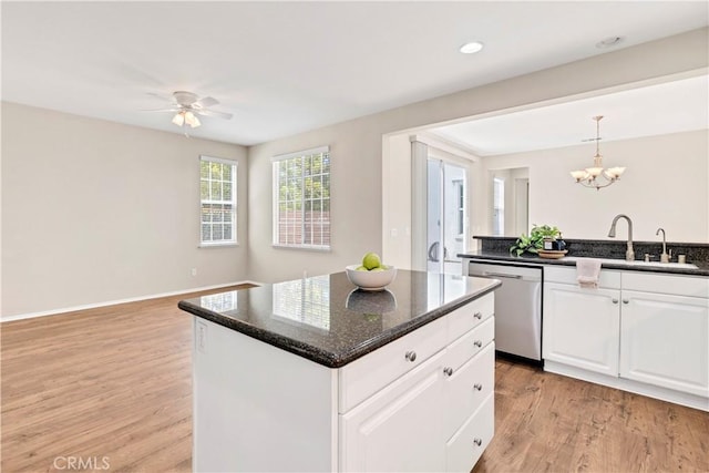 39992 Pasadena Dr, Temecula, CA 92591 - kitchen featuring dishwasher, a sink, light wood-style floors, white cabinets, and a center island