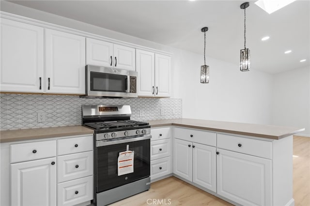 3516 Illinois Trl, Frazier Park, CA 93225 - kitchen with light countertops, stainless steel appliances, and light wood-type flooring