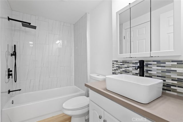 3516 Illinois Trl, Frazier Park, CA 93225 - bathroom with vanity, toilet, tub / shower combination, and decorative backsplash